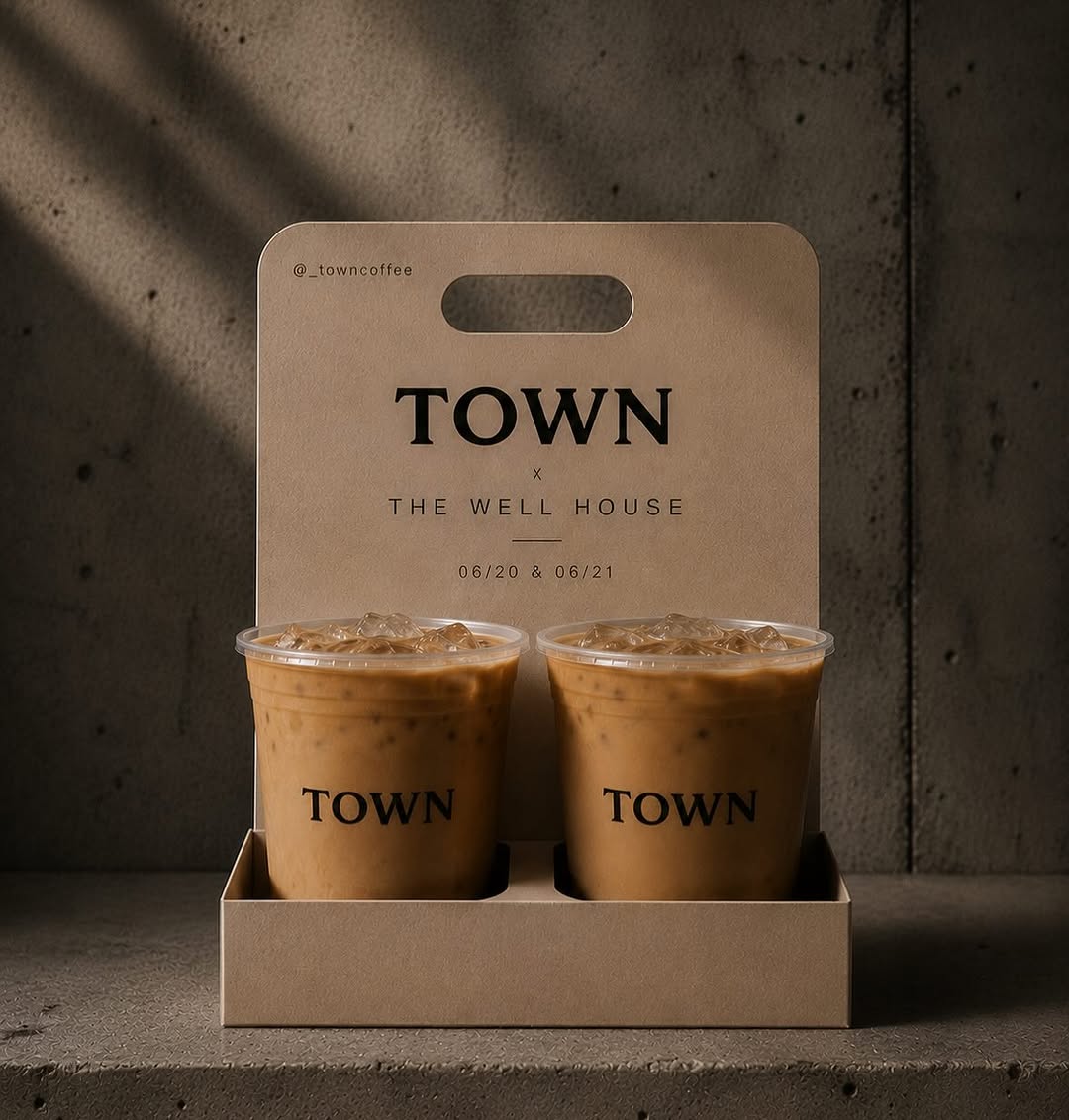 Two iced lattes in Town cups inside a kraft carrier